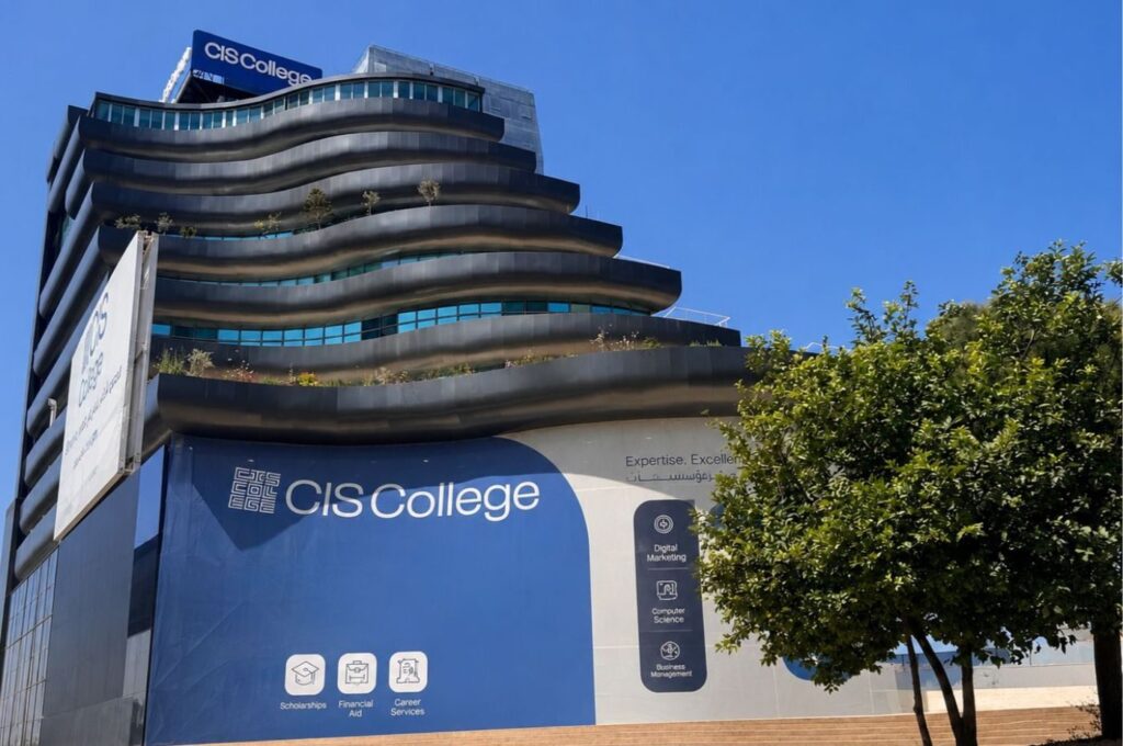 Modern curved building with CIS College signage and blue branding displayed prominently